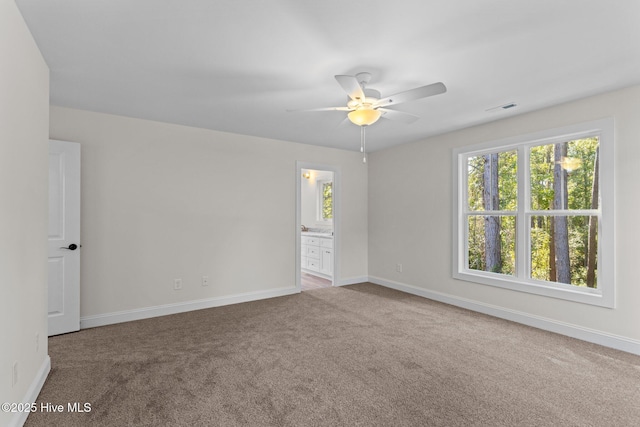 unfurnished room featuring carpet floors and ceiling fan