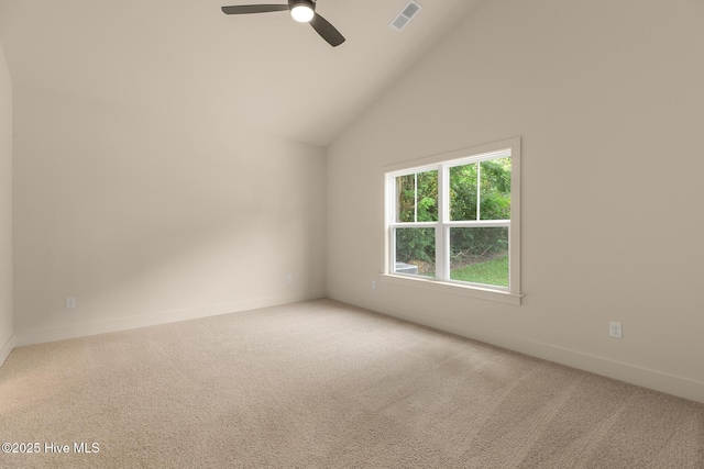 unfurnished room featuring high vaulted ceiling, ceiling fan, and carpet flooring