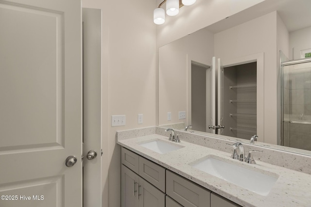 bathroom with an enclosed shower and vanity