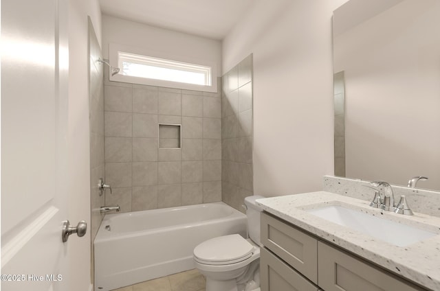 full bathroom featuring toilet, tiled shower / bath combo, tile patterned floors, and vanity