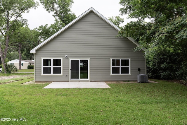 back of property featuring a patio area, central air condition unit, and a lawn