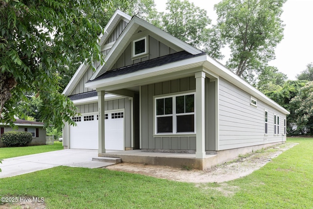 view of side of home with a garage and a lawn