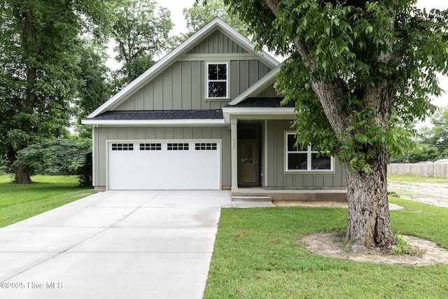 view of front facade with a garage and a front yard