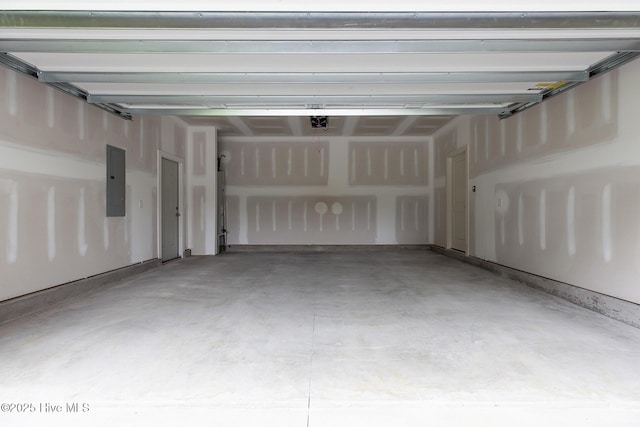 garage with electric panel and a garage door opener