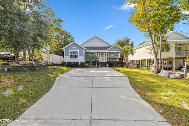 view of front of home featuring a front yard and covered porch