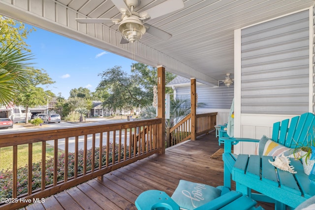 deck with ceiling fan and covered porch