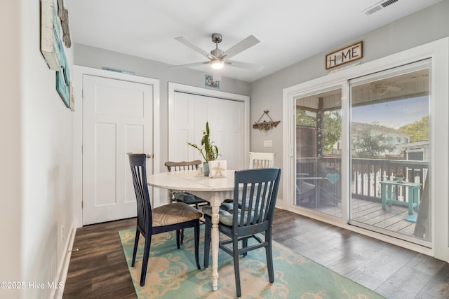 dining space featuring dark hardwood / wood-style flooring and ceiling fan