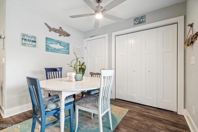 dining area with dark hardwood / wood-style floors and ceiling fan