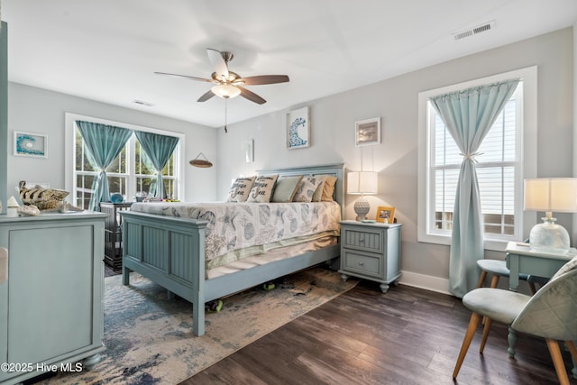 bedroom with dark wood-type flooring and ceiling fan