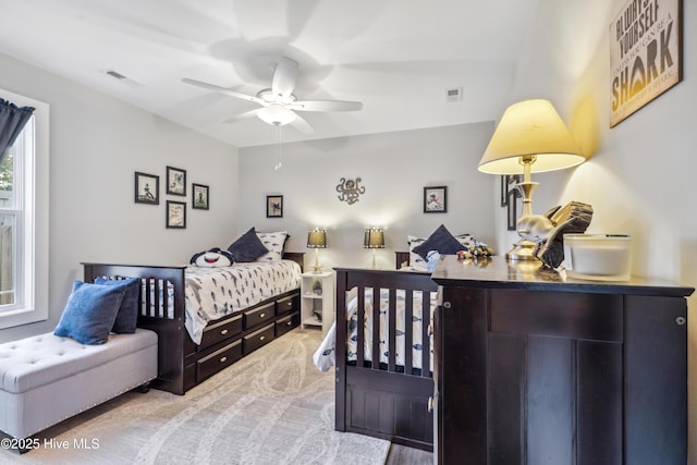 bedroom featuring ceiling fan and carpet floors