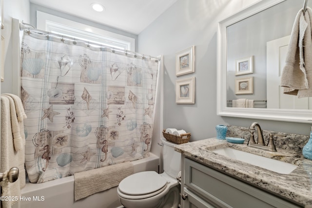 full bathroom featuring vanity, shower / bathtub combination with curtain, and toilet