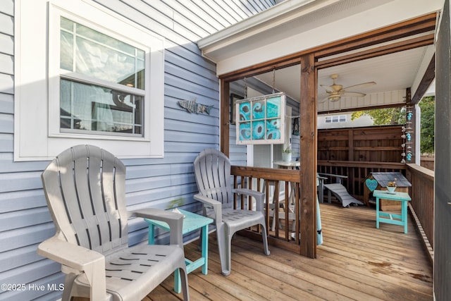 wooden terrace featuring ceiling fan