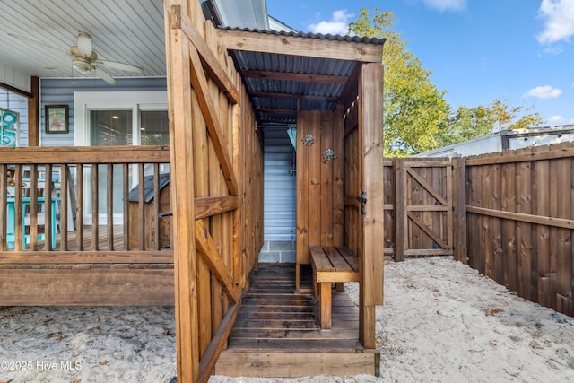 wooden deck featuring ceiling fan