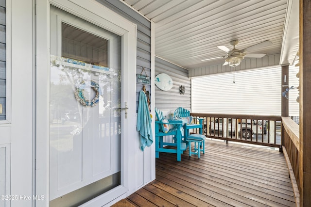 wooden terrace featuring ceiling fan