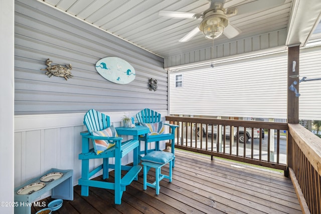 wooden terrace featuring ceiling fan