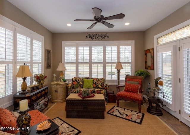 tiled living room with recessed lighting and ceiling fan