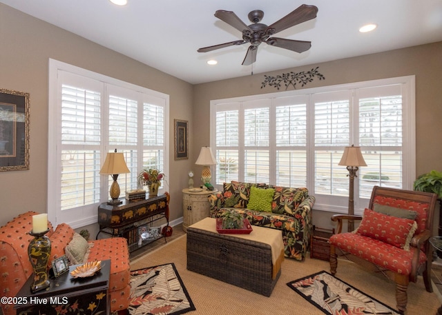 living area with recessed lighting and a ceiling fan