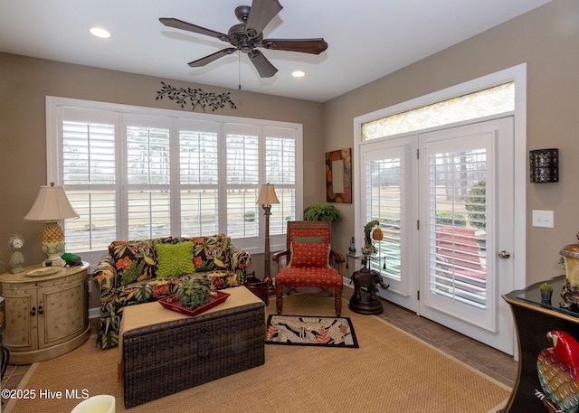 living area featuring recessed lighting, ceiling fan, and tile patterned flooring