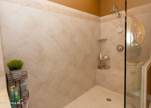 full bath with a tile shower