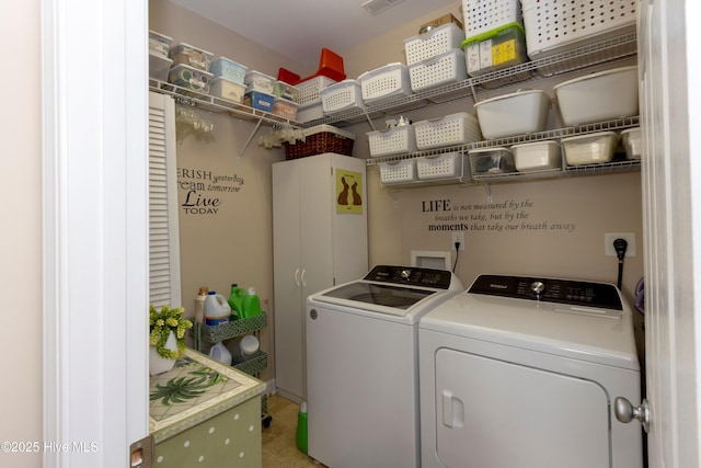 clothes washing area featuring laundry area and washer and dryer