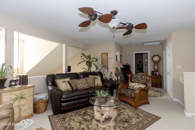 living area with carpet, baseboards, visible vents, vaulted ceiling with beams, and ceiling fan