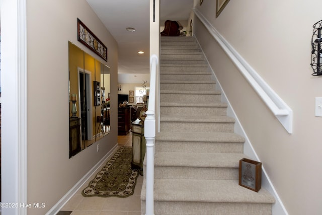 stairway featuring tile patterned floors, recessed lighting, and baseboards