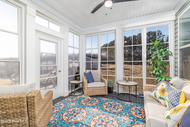 sunroom / solarium with wood ceiling and ceiling fan