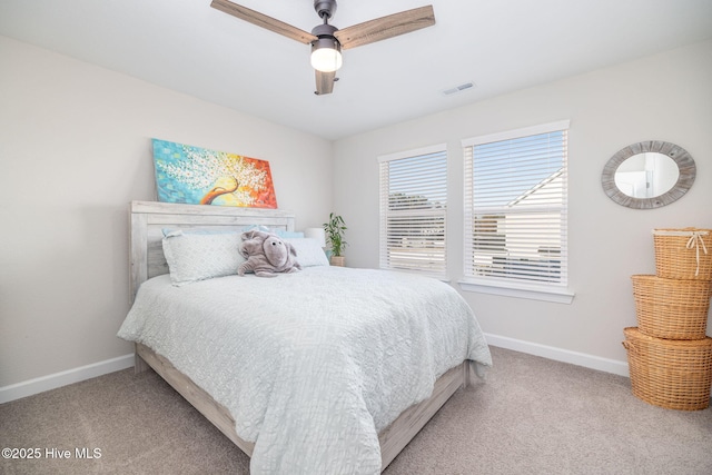 bedroom featuring light carpet and ceiling fan