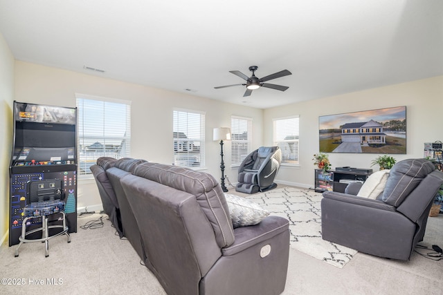 living room featuring light colored carpet and ceiling fan