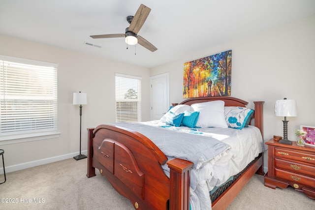 bedroom featuring light colored carpet and ceiling fan