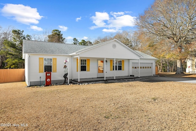 view of front of home with a porch and a garage