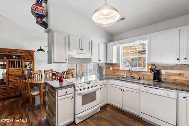 kitchen featuring white cabinetry, white appliances, and hanging light fixtures