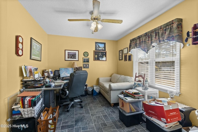 office with ceiling fan and a textured ceiling