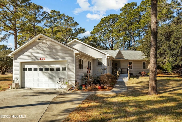 single story home featuring a garage and a front yard