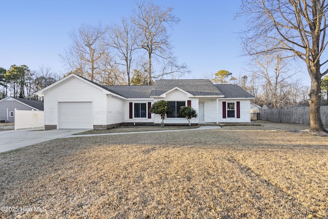 ranch-style home with a garage and a front lawn