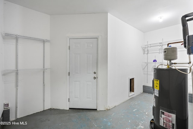 utility room with electric water heater