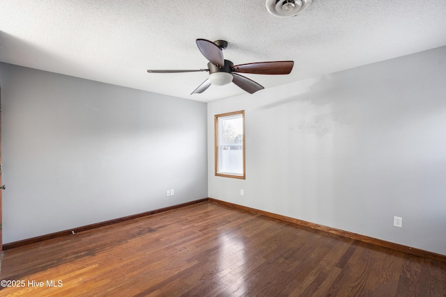 spare room with hardwood / wood-style floors, a textured ceiling, and ceiling fan