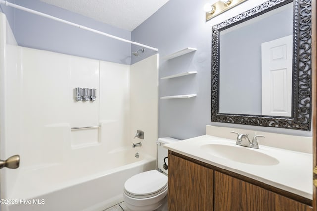 full bathroom with vanity, tub / shower combination, a textured ceiling, and toilet