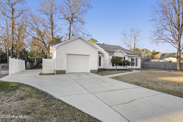 ranch-style house with a garage and a front lawn