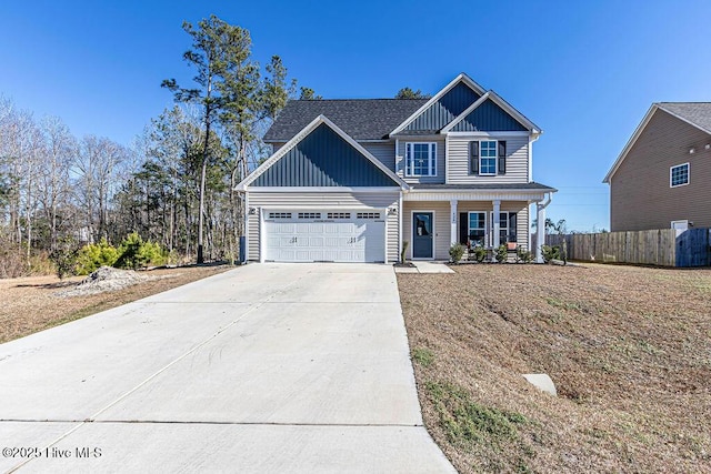 view of front facade with a garage and a porch