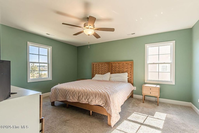 bedroom featuring ceiling fan and light colored carpet