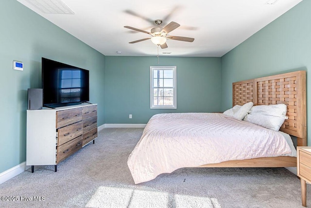 bedroom with light carpet and ceiling fan