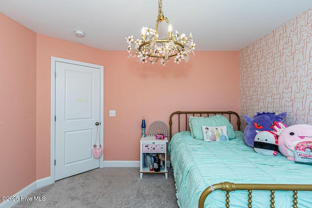 bedroom featuring a notable chandelier and carpet flooring