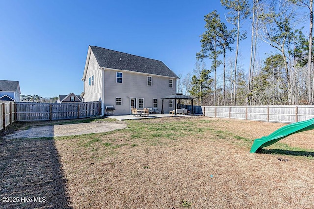 rear view of house with a gazebo and a patio area