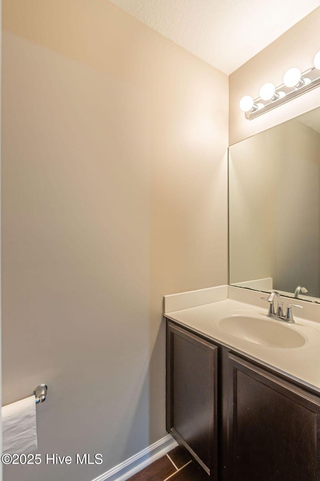 bathroom with vanity and a textured ceiling