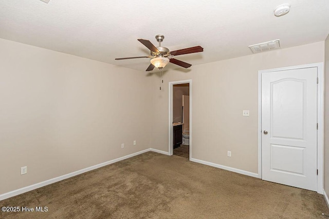 unfurnished room featuring ceiling fan and carpet floors