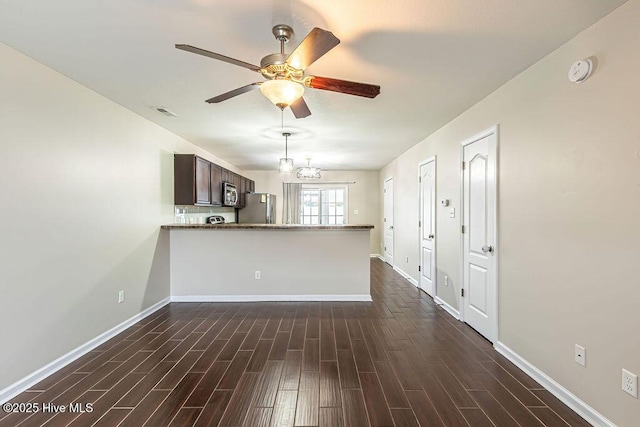 unfurnished living room with ceiling fan