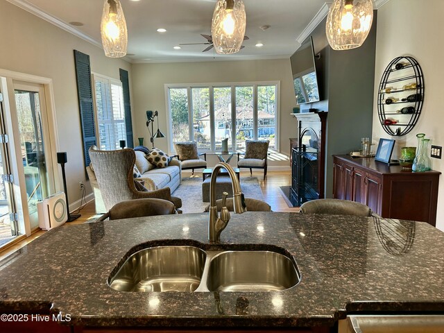 kitchen featuring dark stone countertops and sink