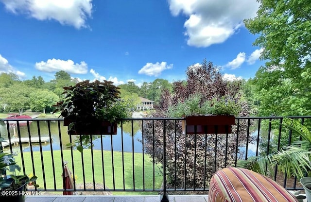 balcony featuring a water view