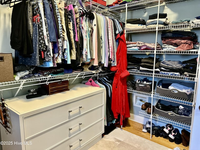 spacious closet with light tile patterned flooring